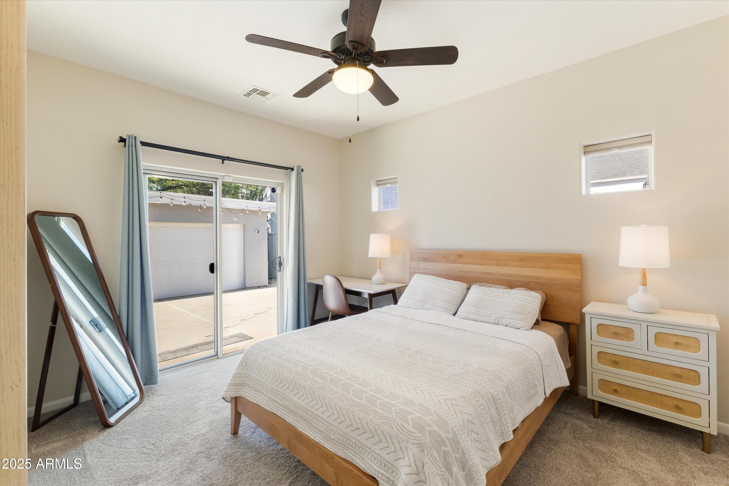 3930 North 30th Street Phoenix, AZ 85016 - Photo 15 of 40 a bedroom with a bed and a chandelier