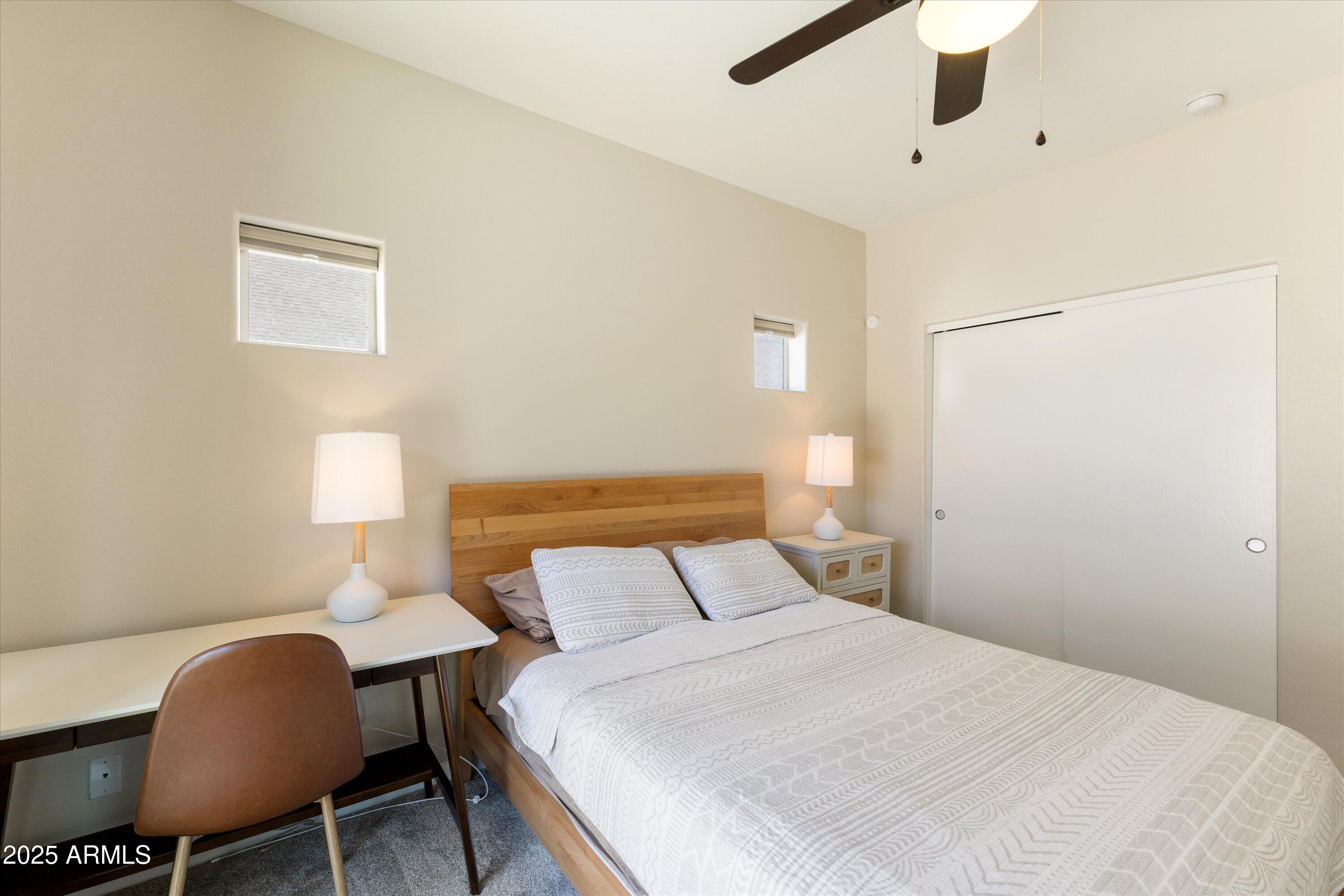 3930 North 30th Street Phoenix, AZ 85016 - Photo 16 of 40 a bedroom with a bed a table and chair