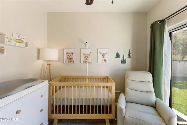 a bedroom with a bed and a lamp