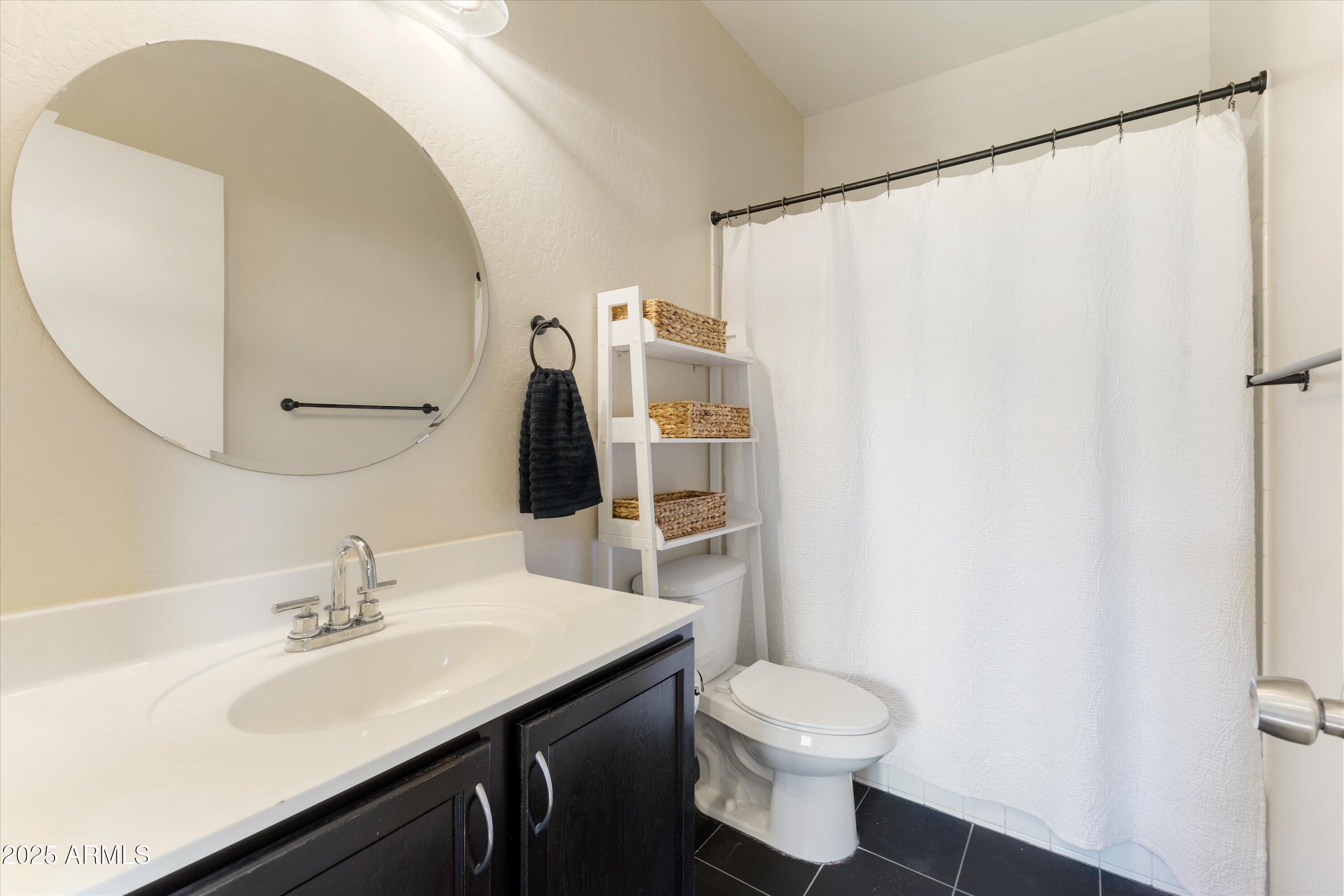 3930 North 30th Street Phoenix, AZ 85016 - Photo 19 of 40 a bathroom with a sink toilet and mirror