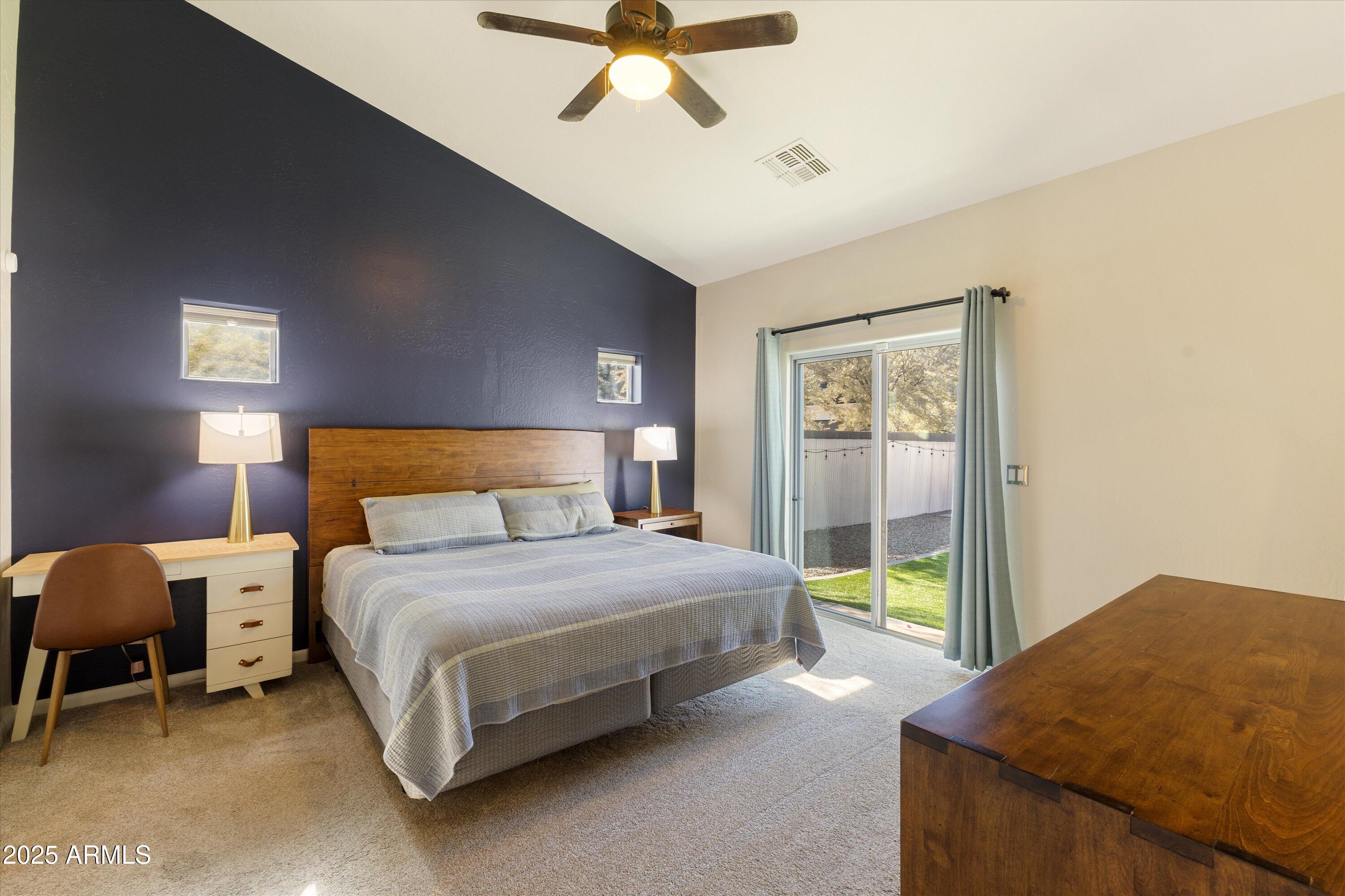 3930 North 30th Street Phoenix, AZ 85016 - Photo 20 of 40 a bedroom with a bed and a chandelier