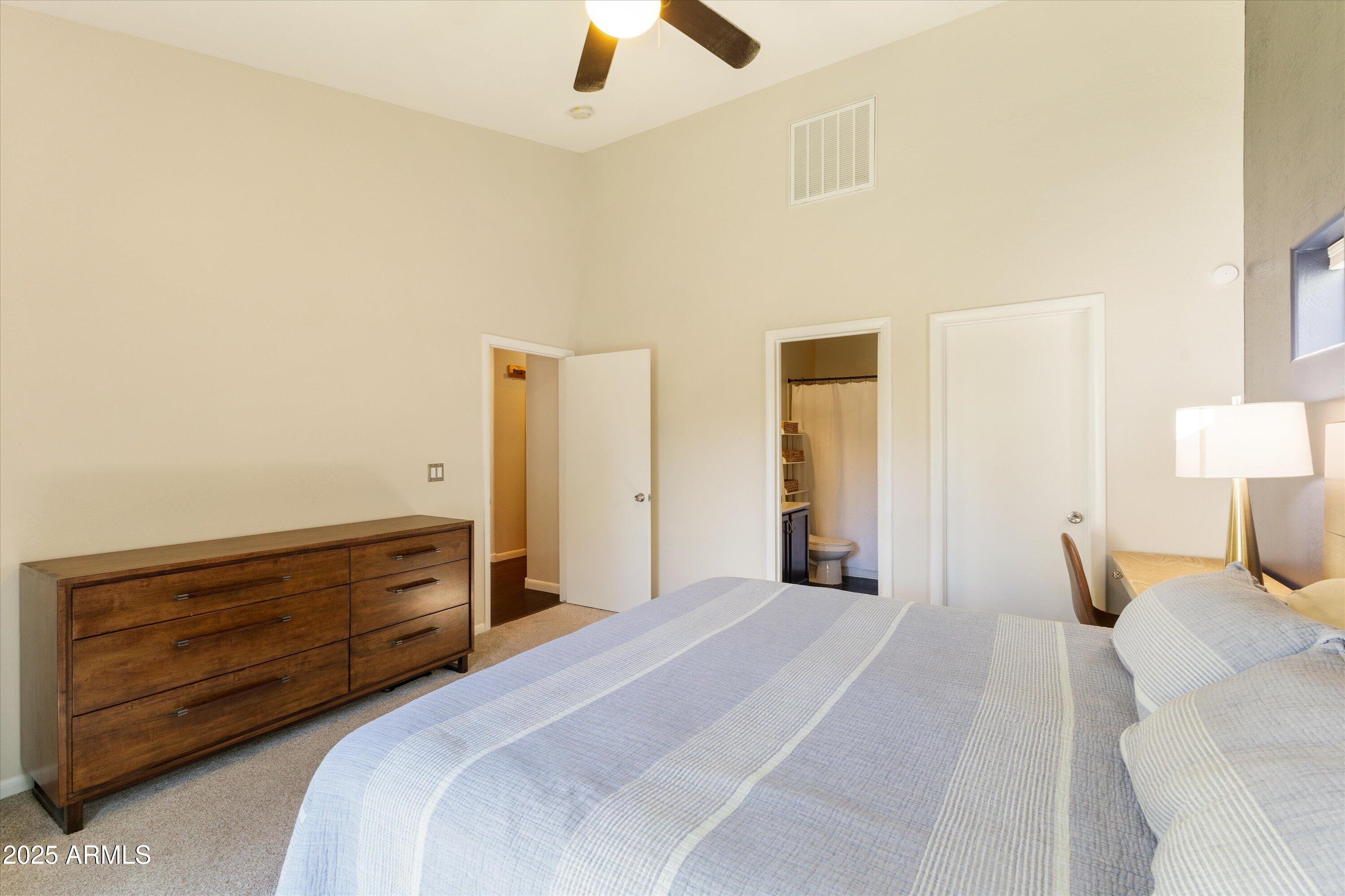3930 North 30th Street Phoenix, AZ 85016 - Photo 22 of 40 a bedroom with a bed and a lamp on dresser