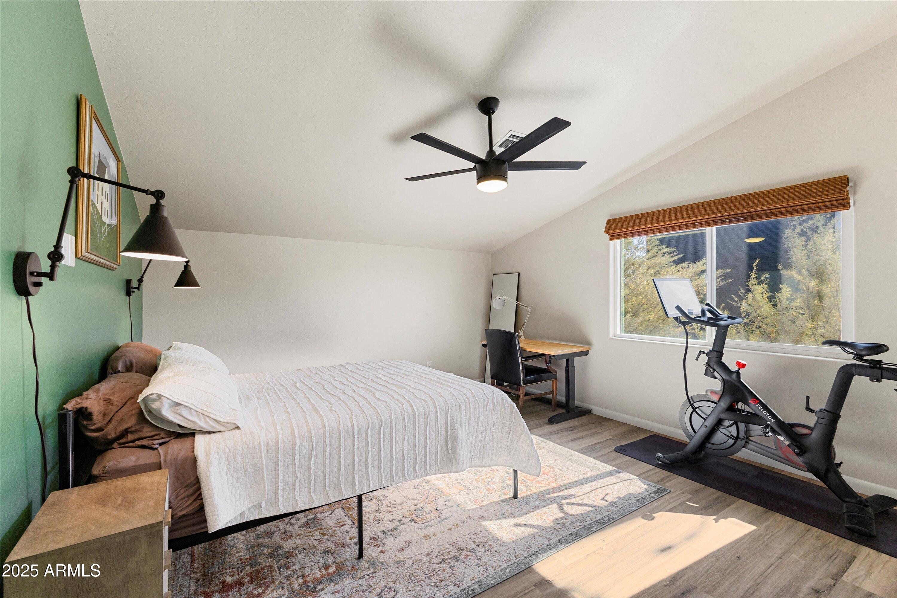 3930 North 30th Street Phoenix, AZ 85016 - Photo 24 of 40 a bedroom with a bed and wooden floor
