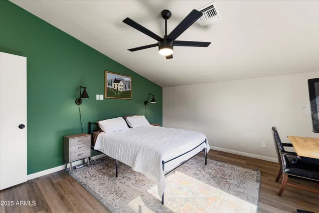 a bedroom with a bed and a dresser