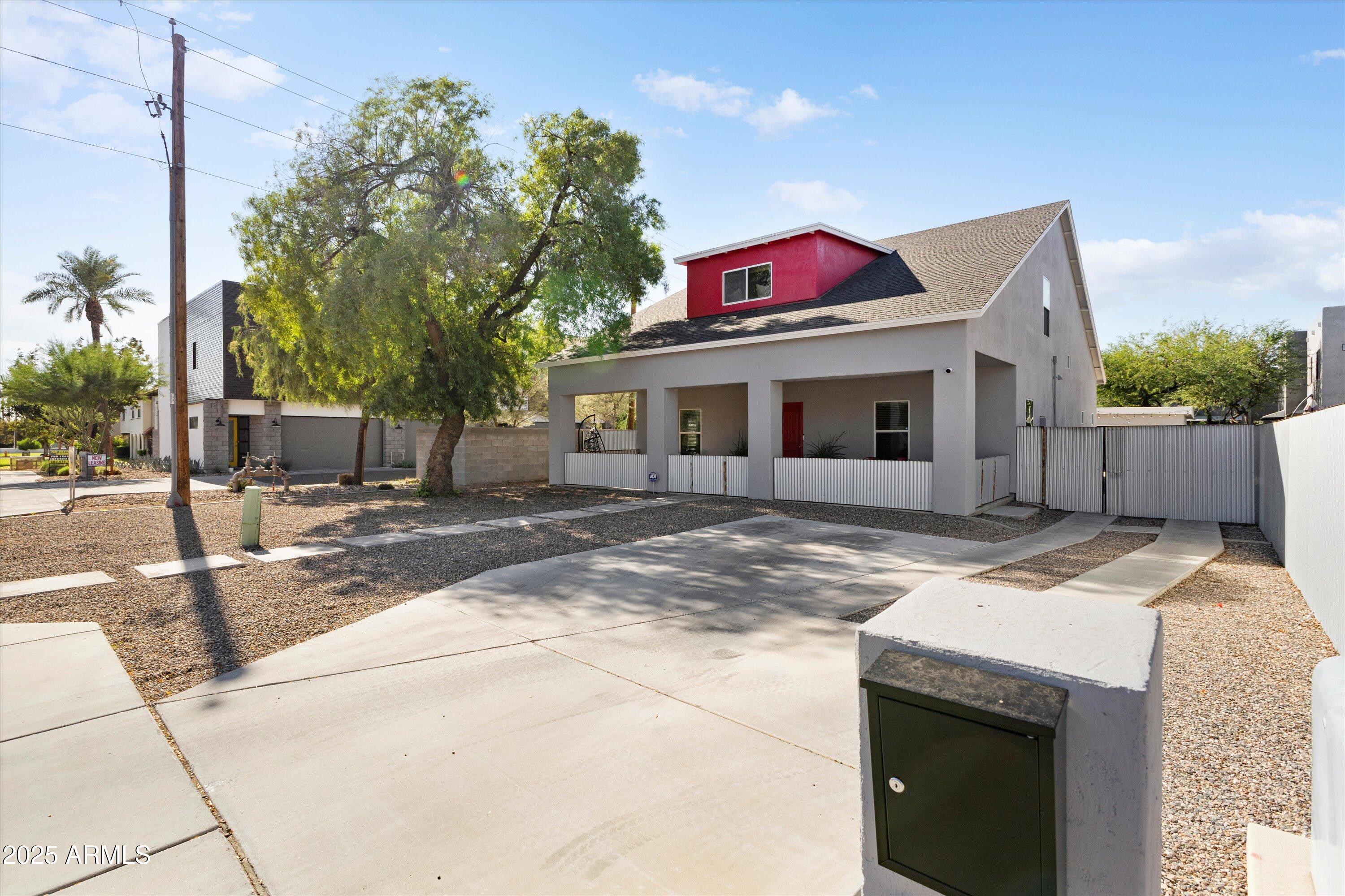 3930 North 30th Street Phoenix, AZ 85016 - Photo 3 of 40 a view of a white house with a sink and yard in the back