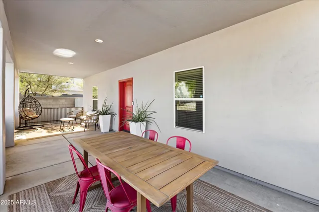 a dining room with a table and chairs