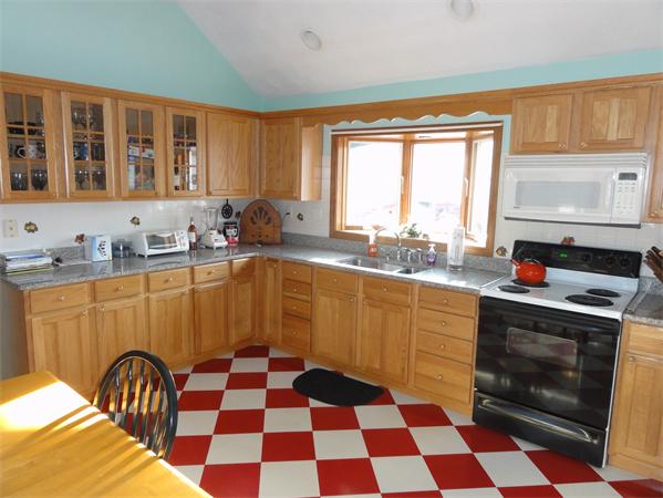 237 Andover Road Billerica, MA 01821 - Photo 3 of 24 a kitchen with granite countertop stainless steel appliances a sink and a window