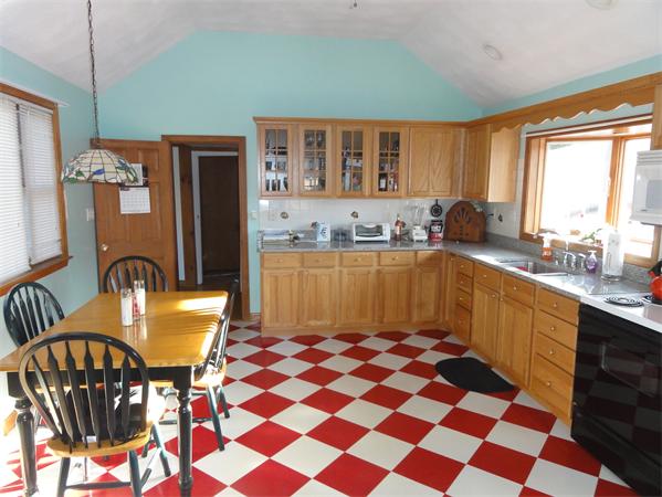 237 Andover Road Billerica, MA 01821 - Photo 4 of 24 a kitchen with a sink a table and chairs
