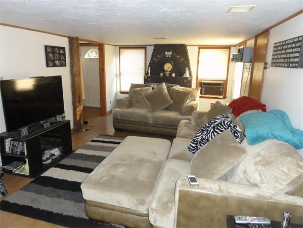 237 Andover Road Billerica, MA 01821 - Photo 8 of 24 a living room with furniture and a flat screen tv