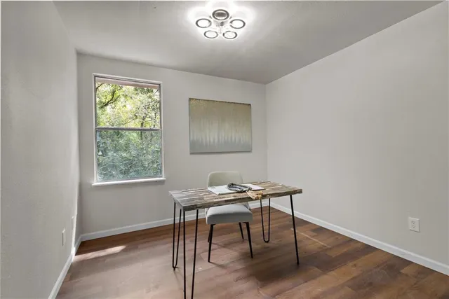 a workspace with furniture and a window