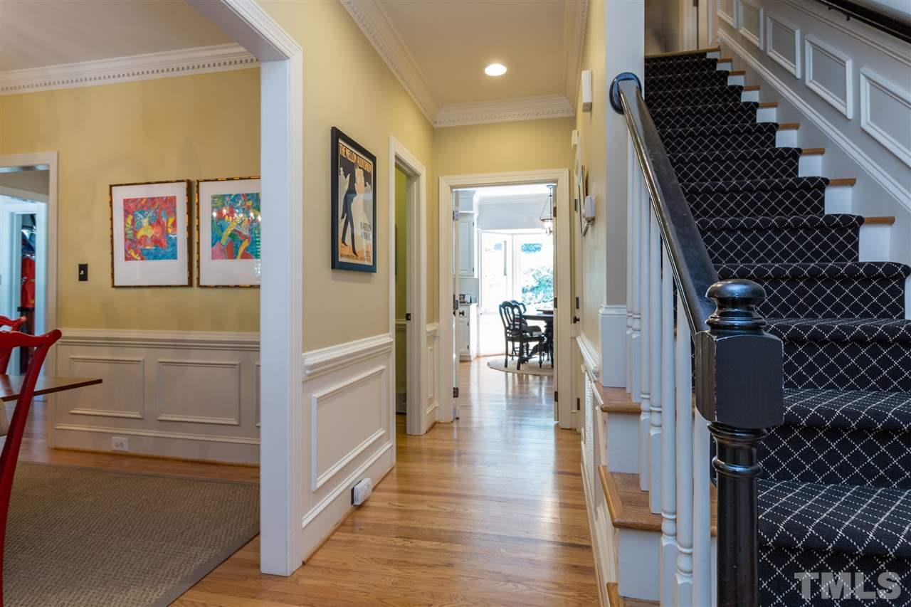 2206 Oxford Road Raleigh, NC 27608 - Photo 2 of 25 a view of hallway with wooden floor and stairs