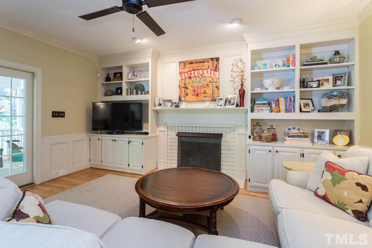 2206 Oxford Road Raleigh, NC 27608 - Photo 11 of 25 a living room with furniture and a flat screen tv