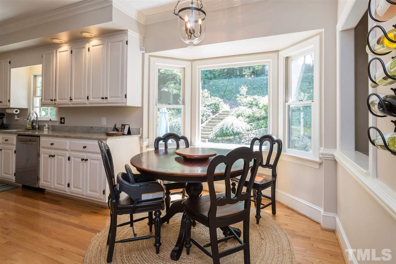 2206 Oxford Road Raleigh, NC 27608 - Photo 5 of 25 a view of a a dining room with furniture window and wooden floor