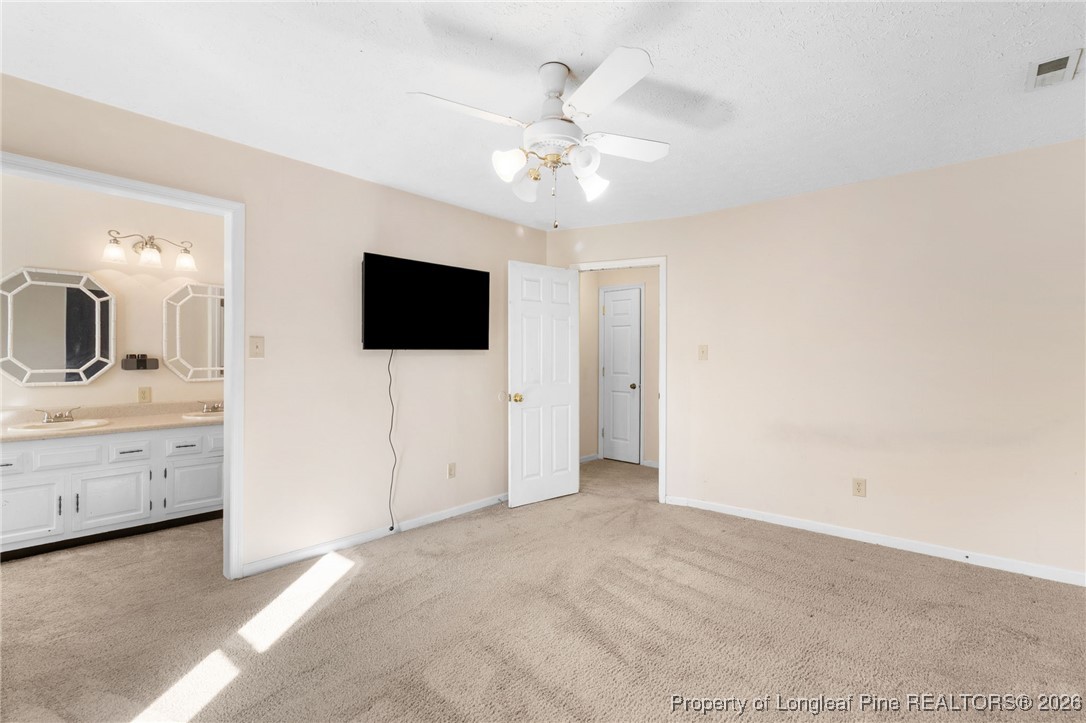 2924 Walden Road Fayetteville, NC 28303 - Photo 28 of 44 a view of a livingroom with chandelier fan and bathroom
