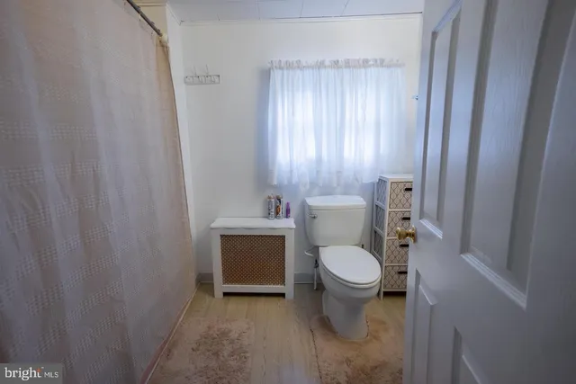 a bathroom with a toilet and a sink
