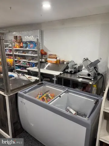 a close up of a sink a stove and storage