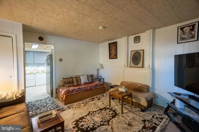 a bedroom with furniture and flat screen tv