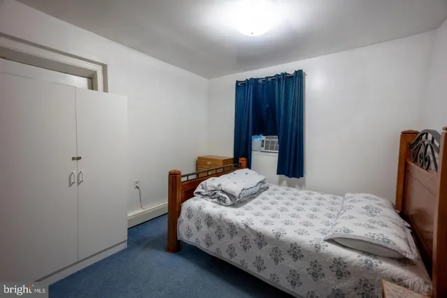 a bedroom with a bed and a closet