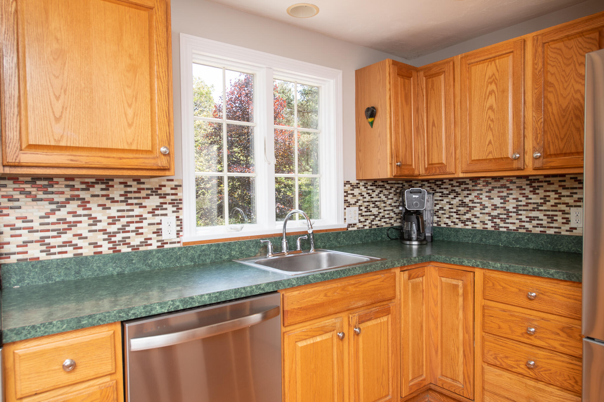 8 Yachtsman Circle Mashpee, MA 02649 - Photo 11 of 56 a kitchen with granite countertop a sink a counter top space and cabinets