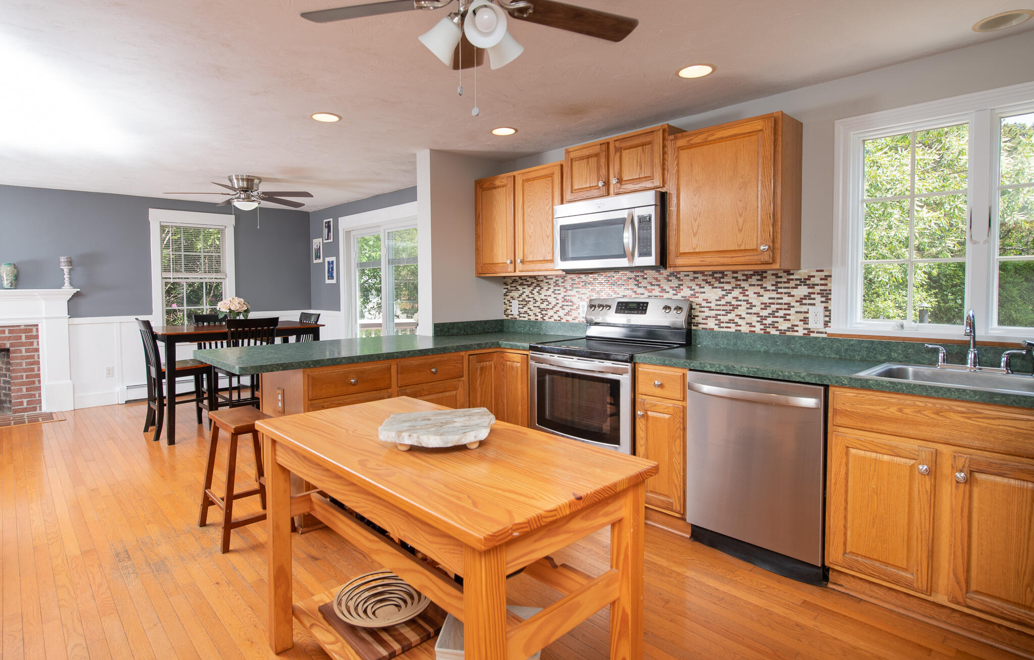 8 Yachtsman Circle Mashpee, MA 02649 - Photo 12 of 56 a kitchen with stainless steel appliances granite countertop a sink a stove and a refrigerator