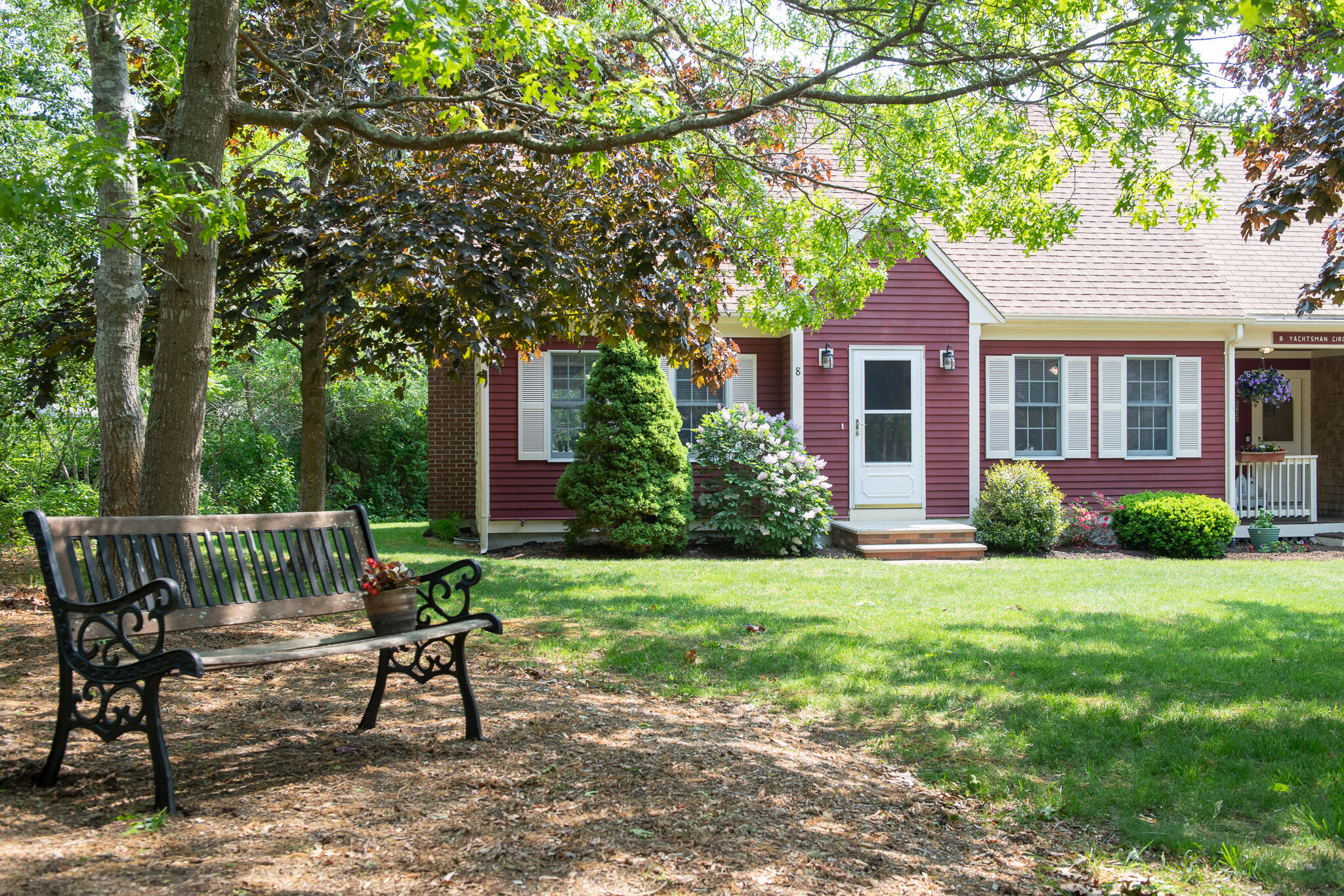 8 Yachtsman Circle Mashpee, MA 02649 - Photo 2 of 56 a view of a house with backyard sitting area and garden