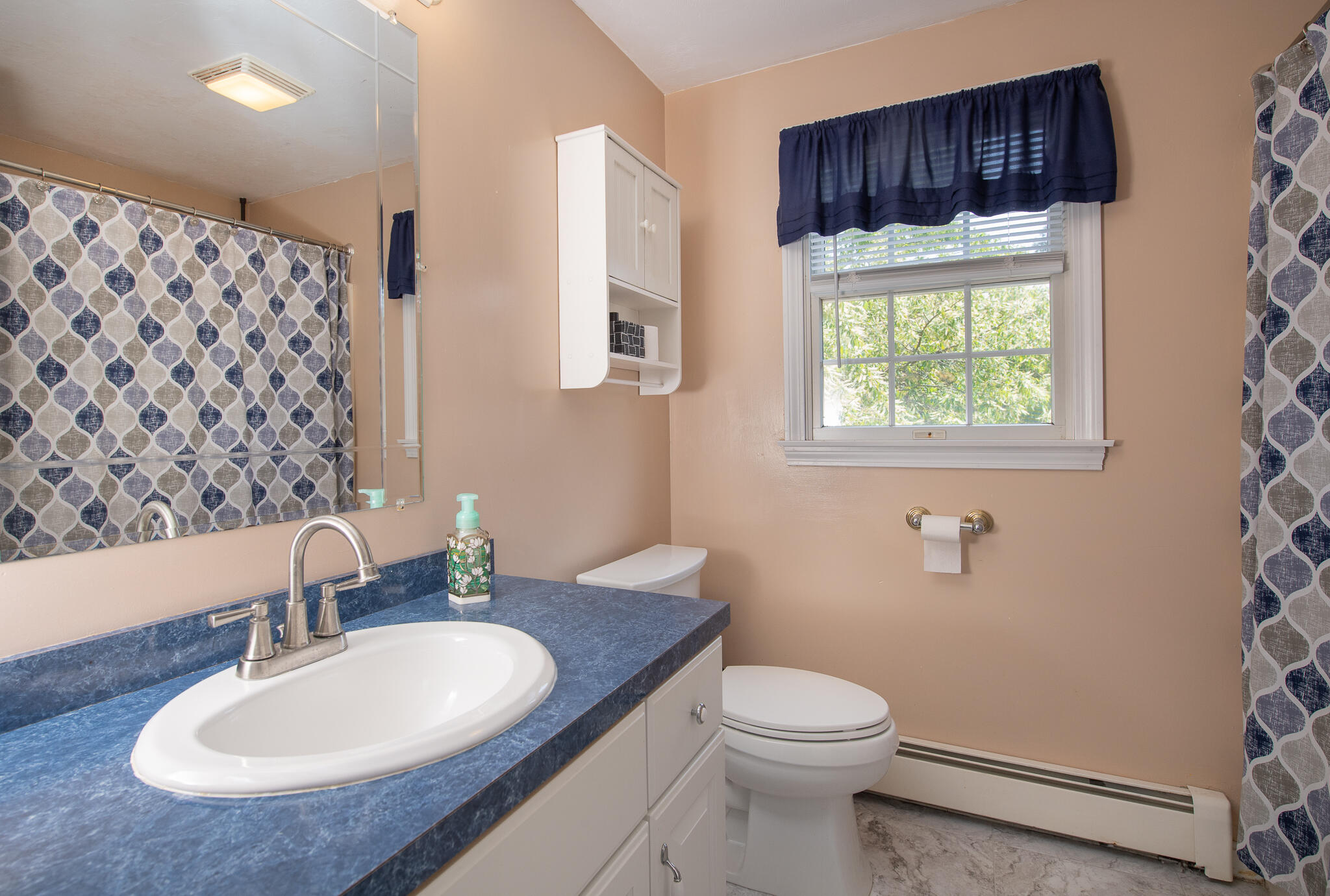 8 Yachtsman Circle Mashpee, MA 02649 - Photo 23 of 56 a bathroom with a sink a toilet and shower curtain