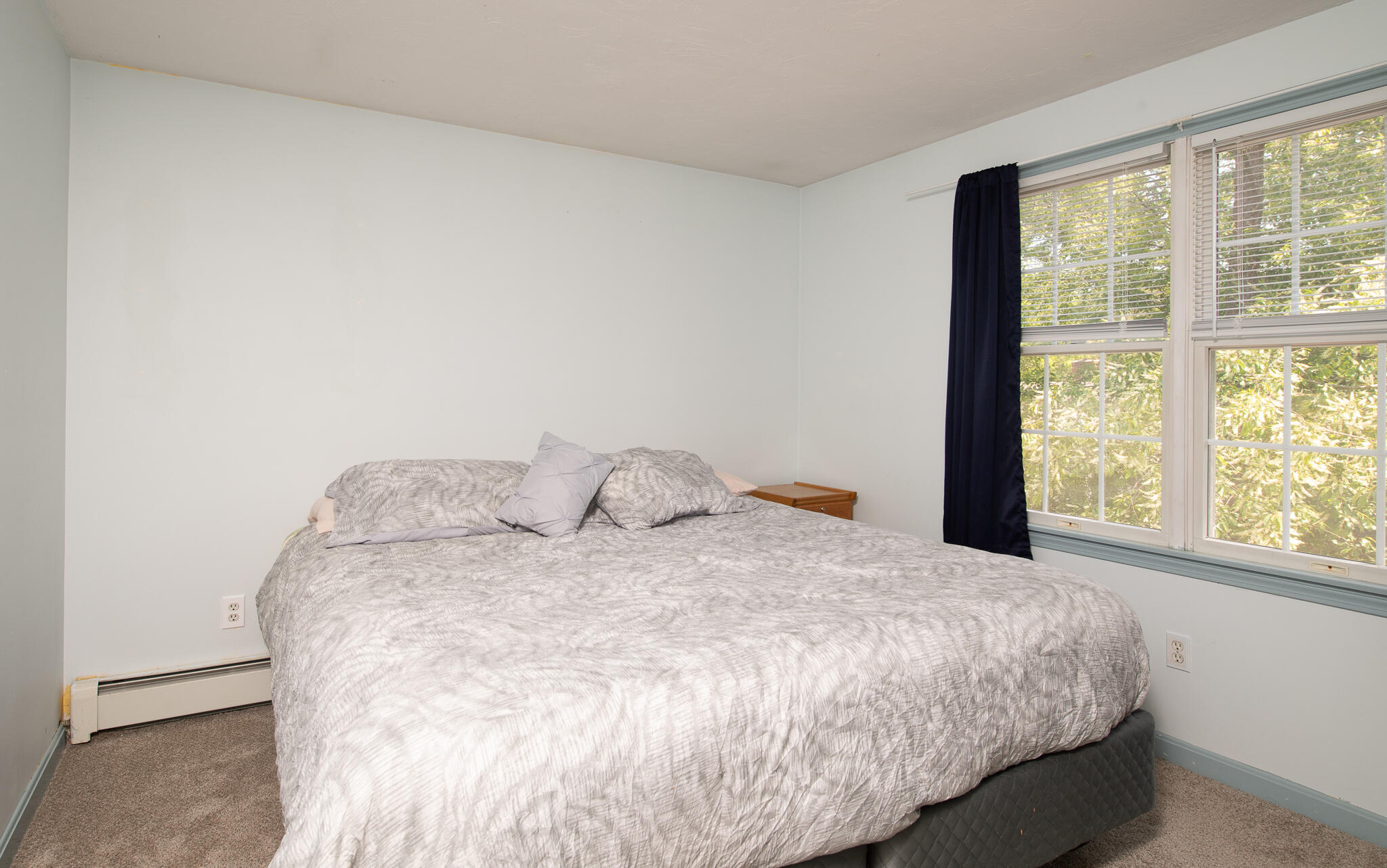 8 Yachtsman Circle Mashpee, MA 02649 - Photo 25 of 56 a large bed sitting in a bedroom next to a window