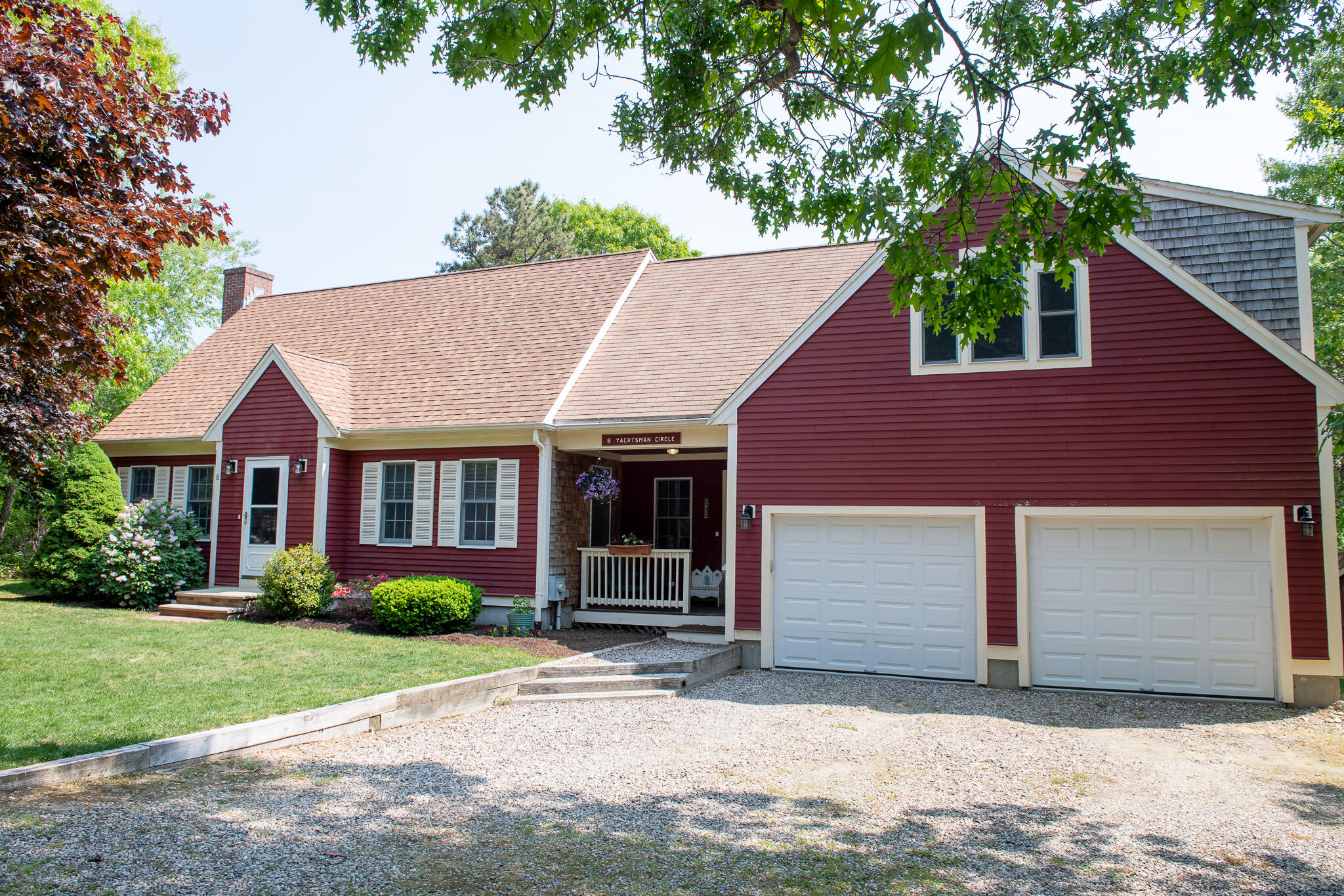 8 Yachtsman Circle Mashpee, MA 02649 - Photo 3 of 56 a house that has a tree in front of the house