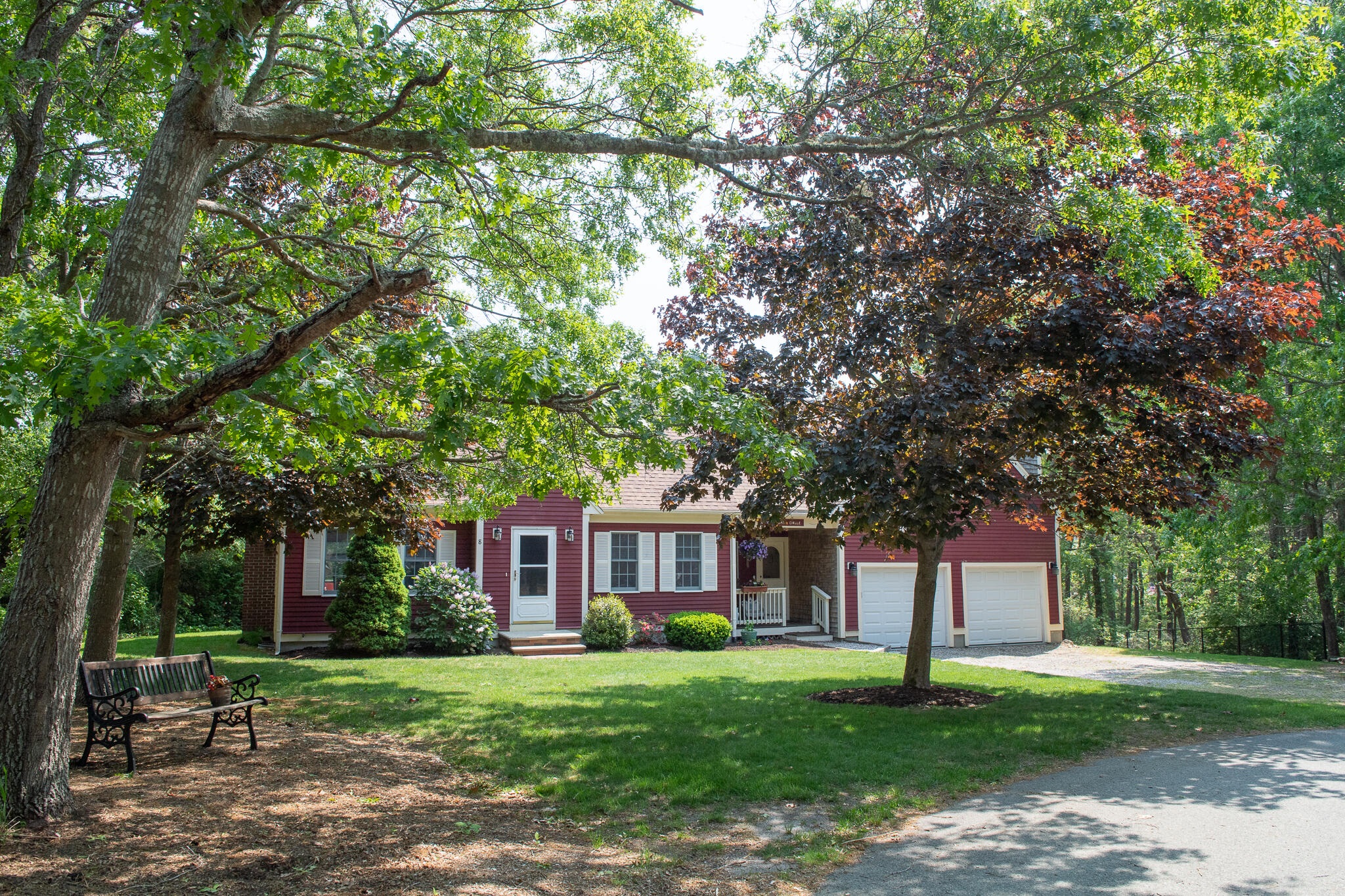 8 Yachtsman Circle Mashpee, MA 02649 - Photo 32 of 56 a front view of a house with a garden