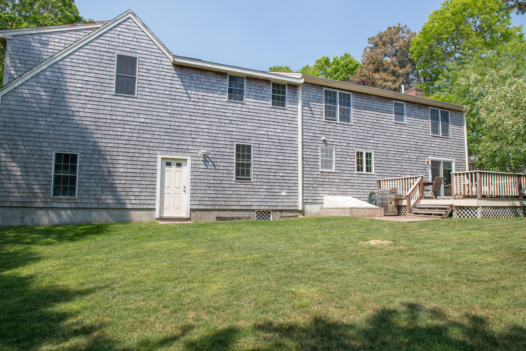 8 Yachtsman Circle Mashpee, MA 02649 - Photo 41 of 56 a view of a house with a backyard