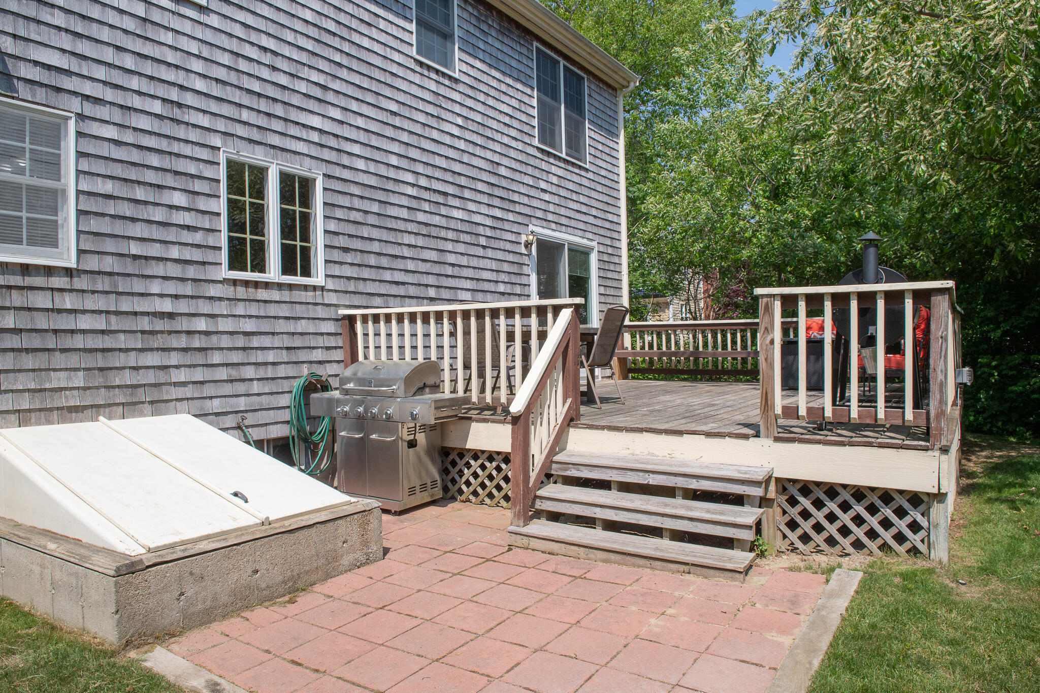 8 Yachtsman Circle Mashpee, MA 02649 - Photo 42 of 56 a view of a patio with a table and chairs