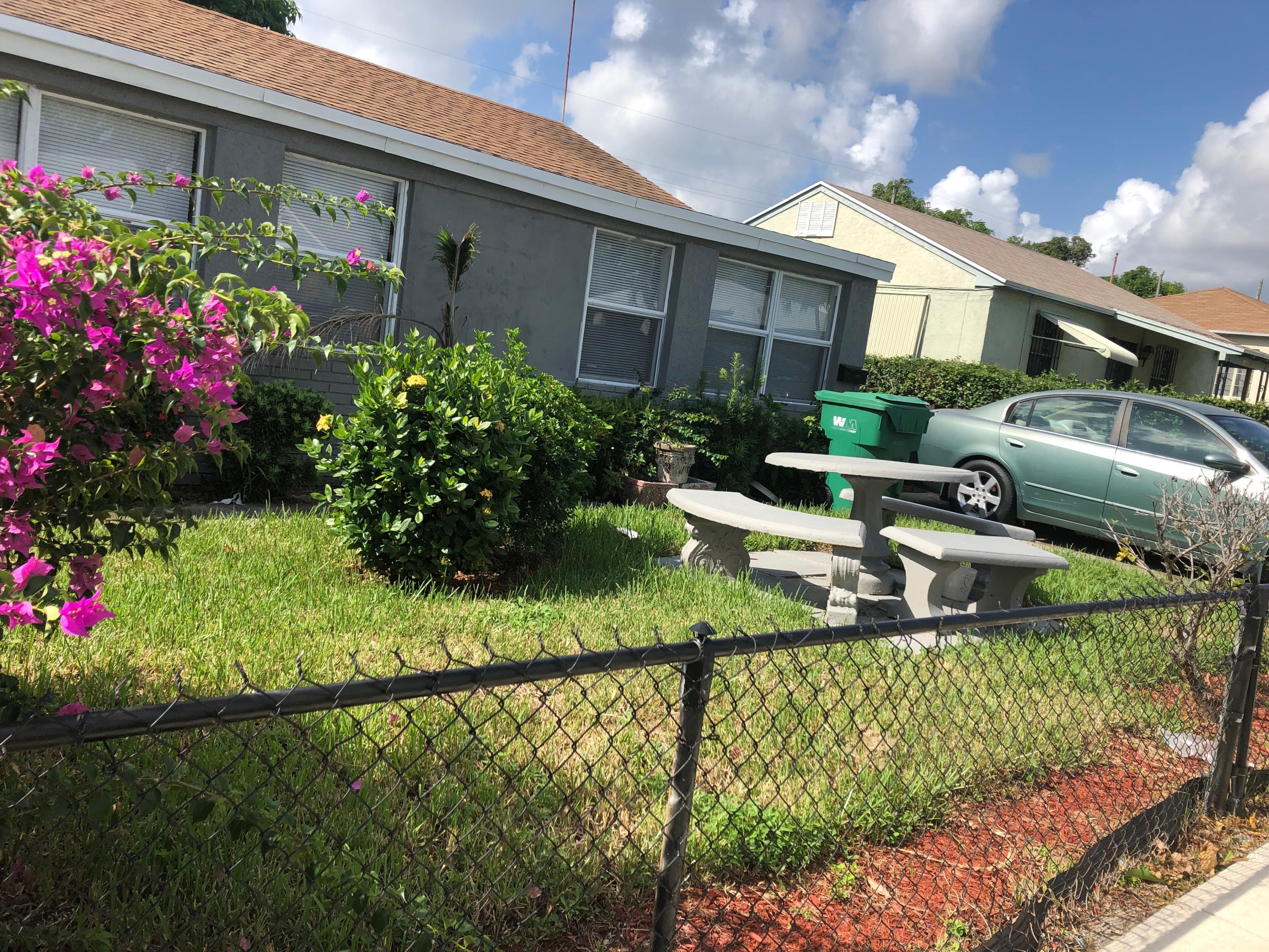 717 West 4th Street Riviera Beach, FL 33404 - Photo 1 of 35 Front
