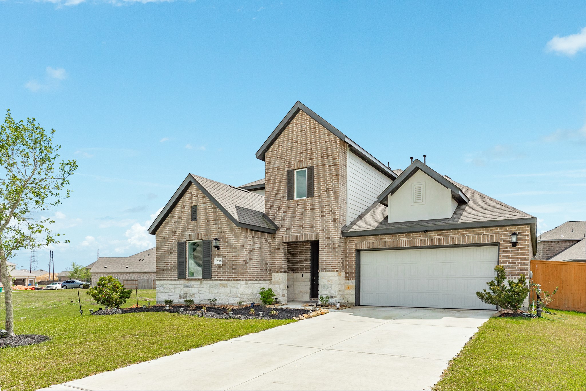 2618 Jasper Oaks Drive Rosharon, TX 77583 - Photo 37 of 43 a front view of a house with a yard and garage