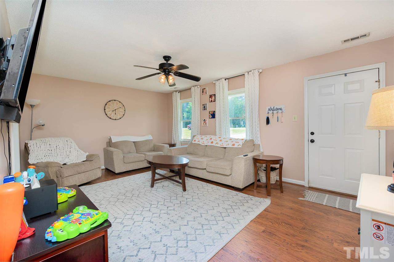 321 Jeribec Drive Willow Spring, NC 27592 - Photo 12 of 21 a living room with furniture and a wooden floor