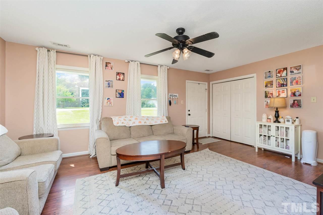 321 Jeribec Drive Willow Spring, NC 27592 - Photo 13 of 21 a living room with furniture and a window