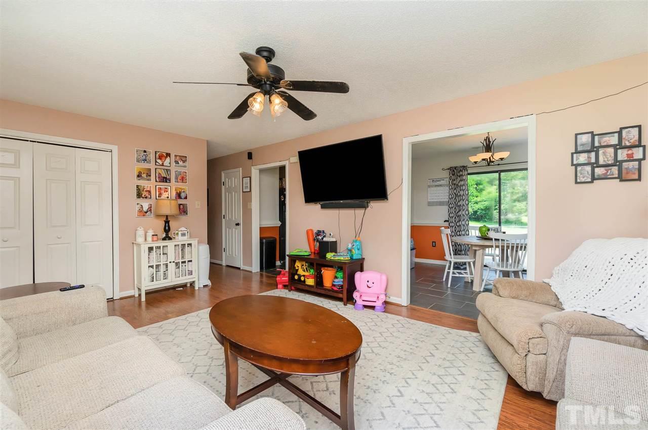 321 Jeribec Drive Willow Spring, NC 27592 - Photo 14 of 21 a living room with furniture and a flat screen tv