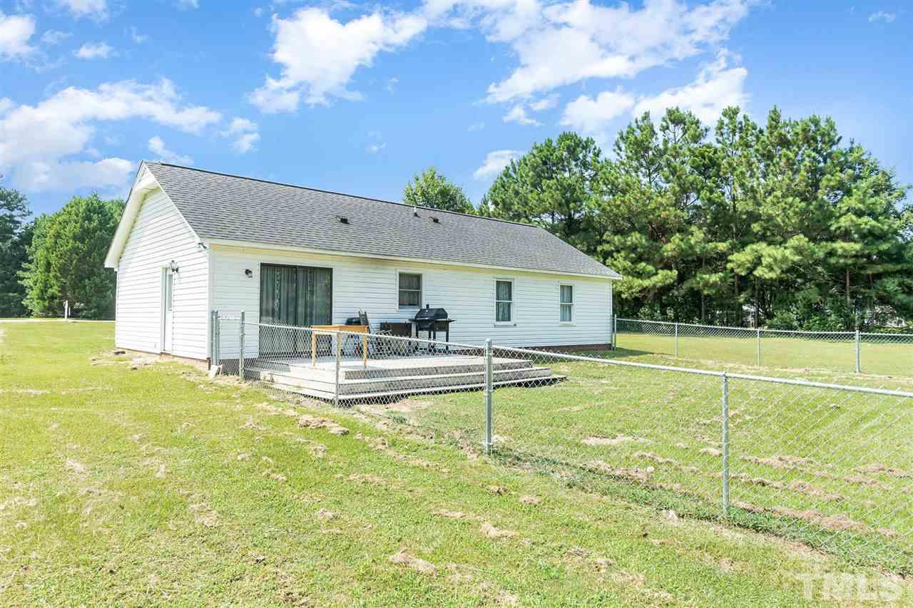 321 Jeribec Drive Willow Spring, NC 27592 - Photo 19 of 21 a view of a house with swimming pool and a yard