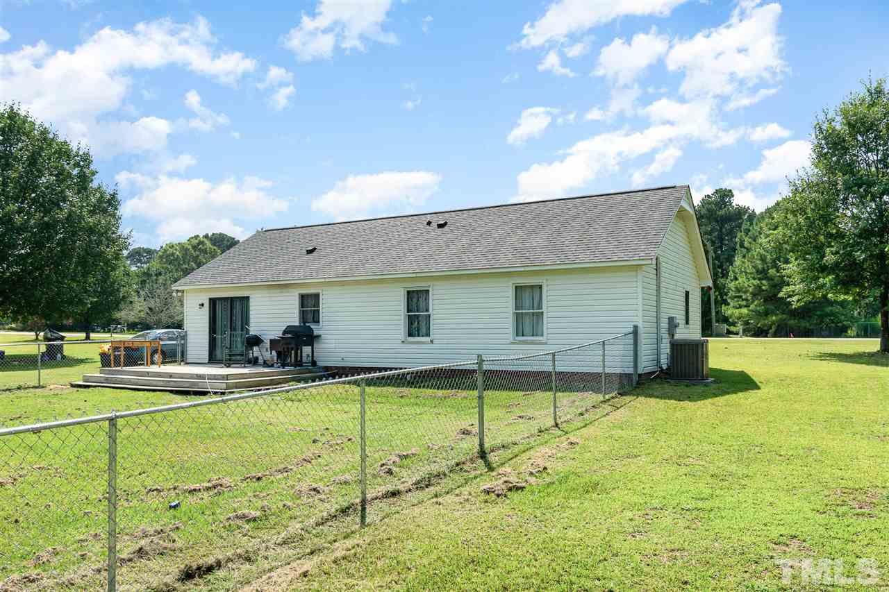 321 Jeribec Drive Willow Spring, NC 27592 - Photo 20 of 21 a house view with a sitting space and garden