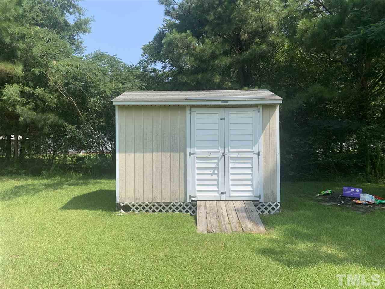321 Jeribec Drive Willow Spring, NC 27592 - Photo 4 of 21 a front view of a house with a garden