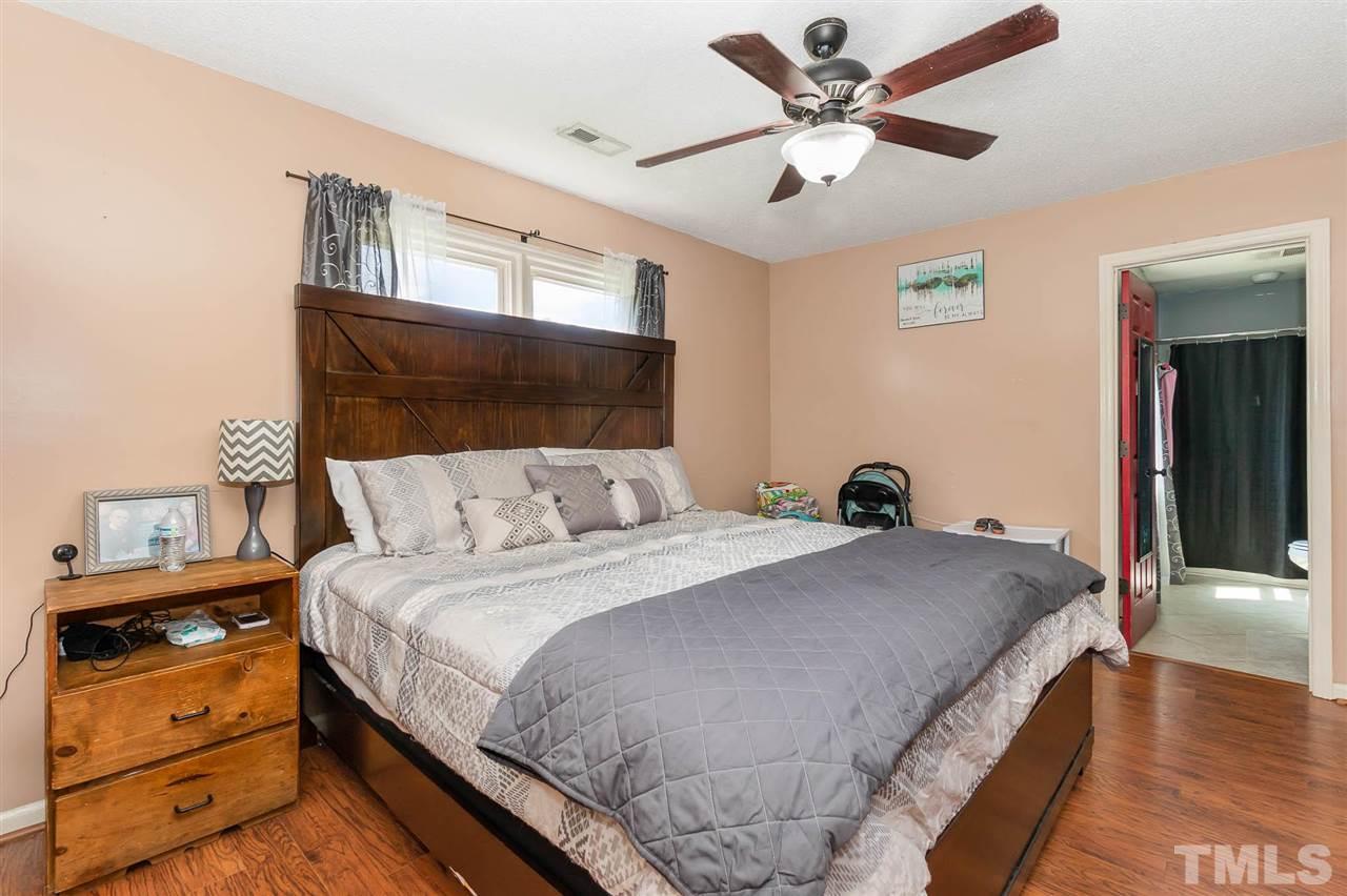 321 Jeribec Drive Willow Spring, NC 27592 - Photo 6 of 21 a bedroom with bed and wooden floor