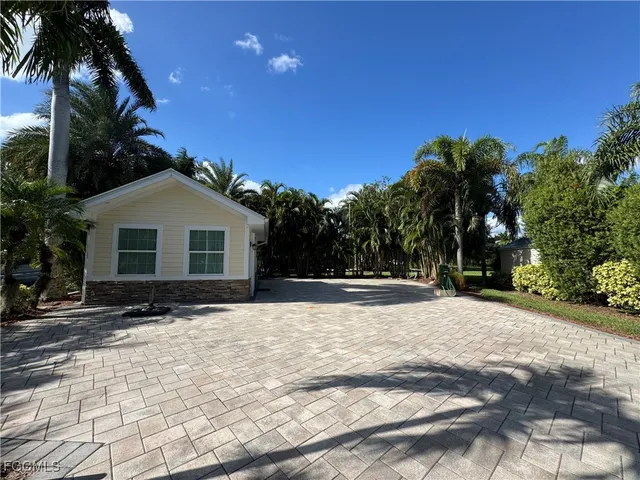 a view of a backyard of the house