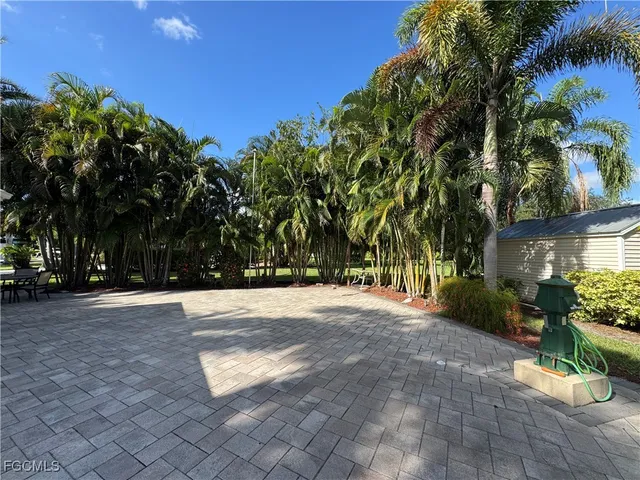 a view of a house with a backyard