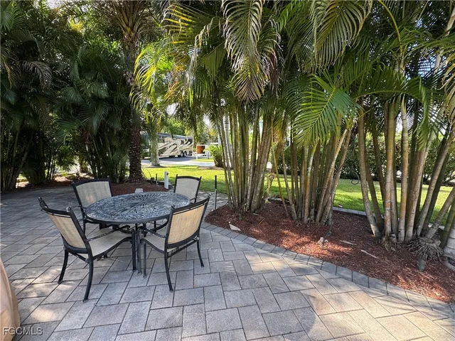 a view of backyard with outdoor seating