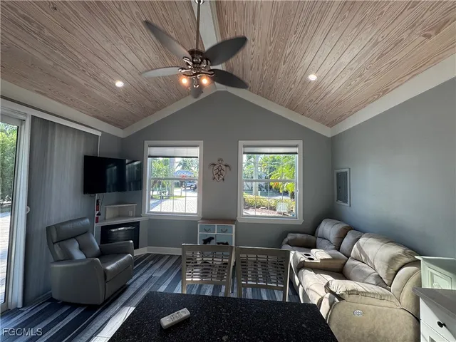 a kitchen with stainless steel appliances granite countertop a sink a stove and white cabinets