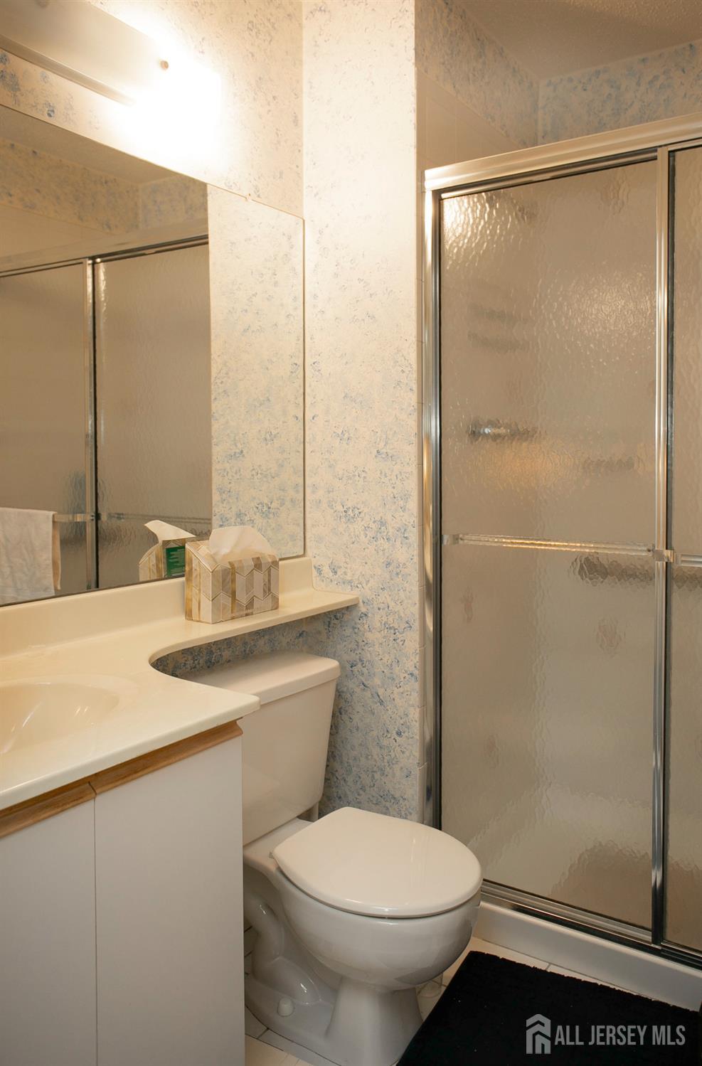 77 Linda Lane Edison, NJ 08820 - Photo 13 of 21 a bathroom with a granite countertop sink toilet and shower