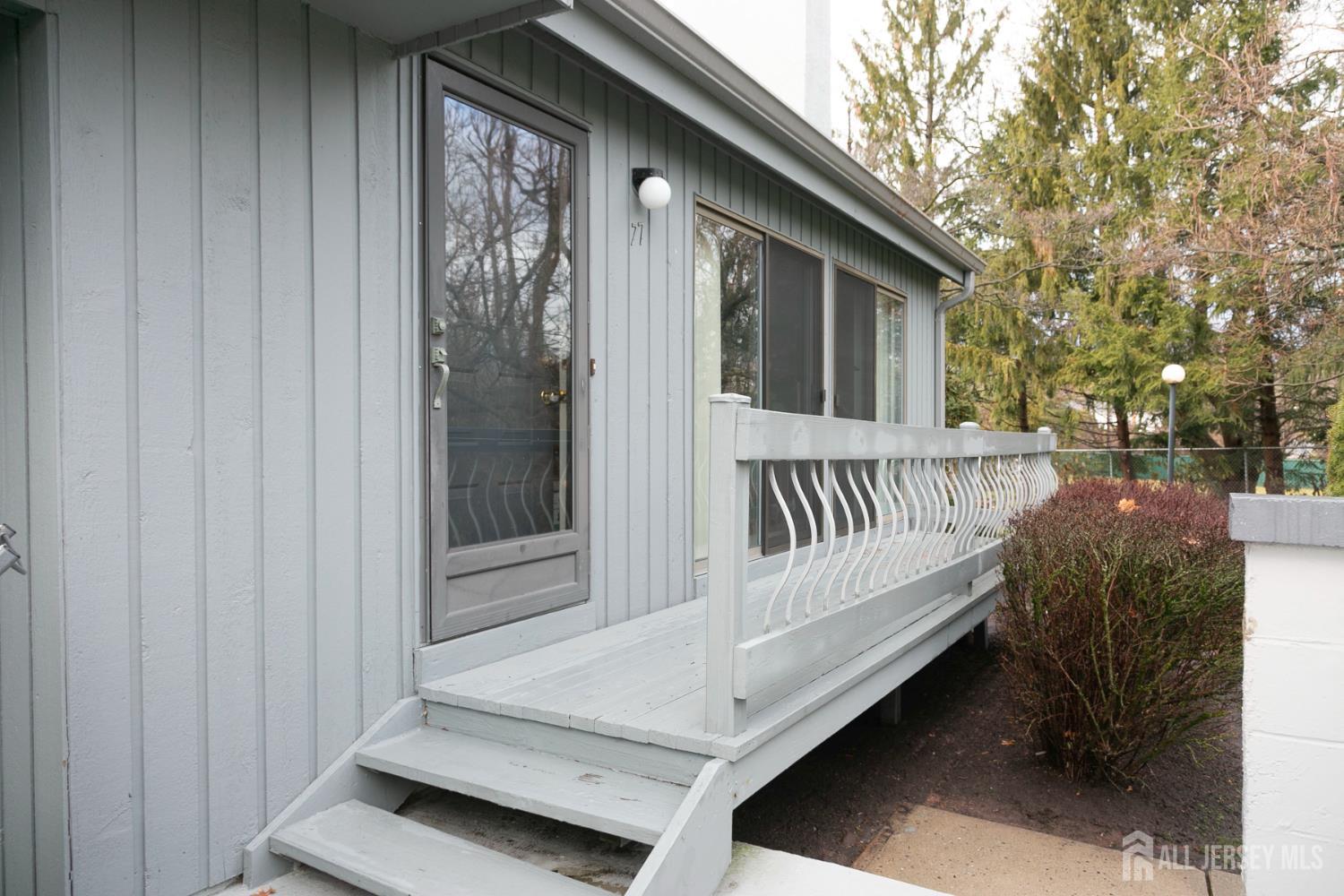 77 Linda Lane Edison, NJ 08820 - Photo 21 of 21 a view of backyard with deck and outdoor seating