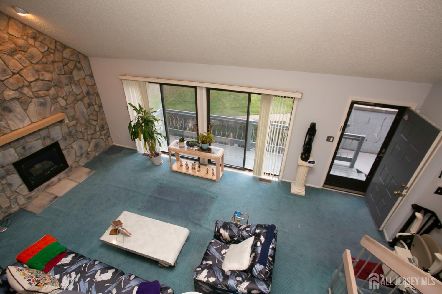 77 Linda Lane Edison, NJ 08820 - Photo 5 of 21 a living room with furniture and a fireplace