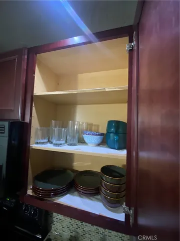 a room with closet and mirror