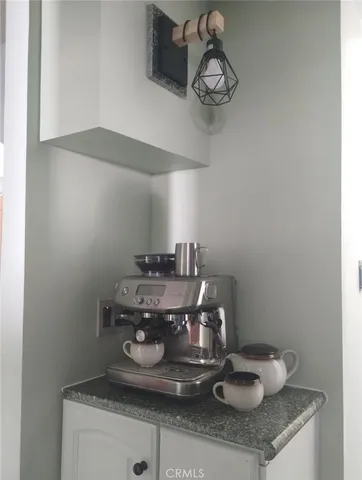 a stove top oven sitting inside of a kitchen