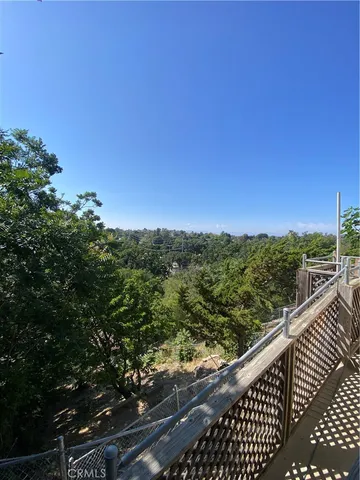 a view of outdoor space with wooden fence